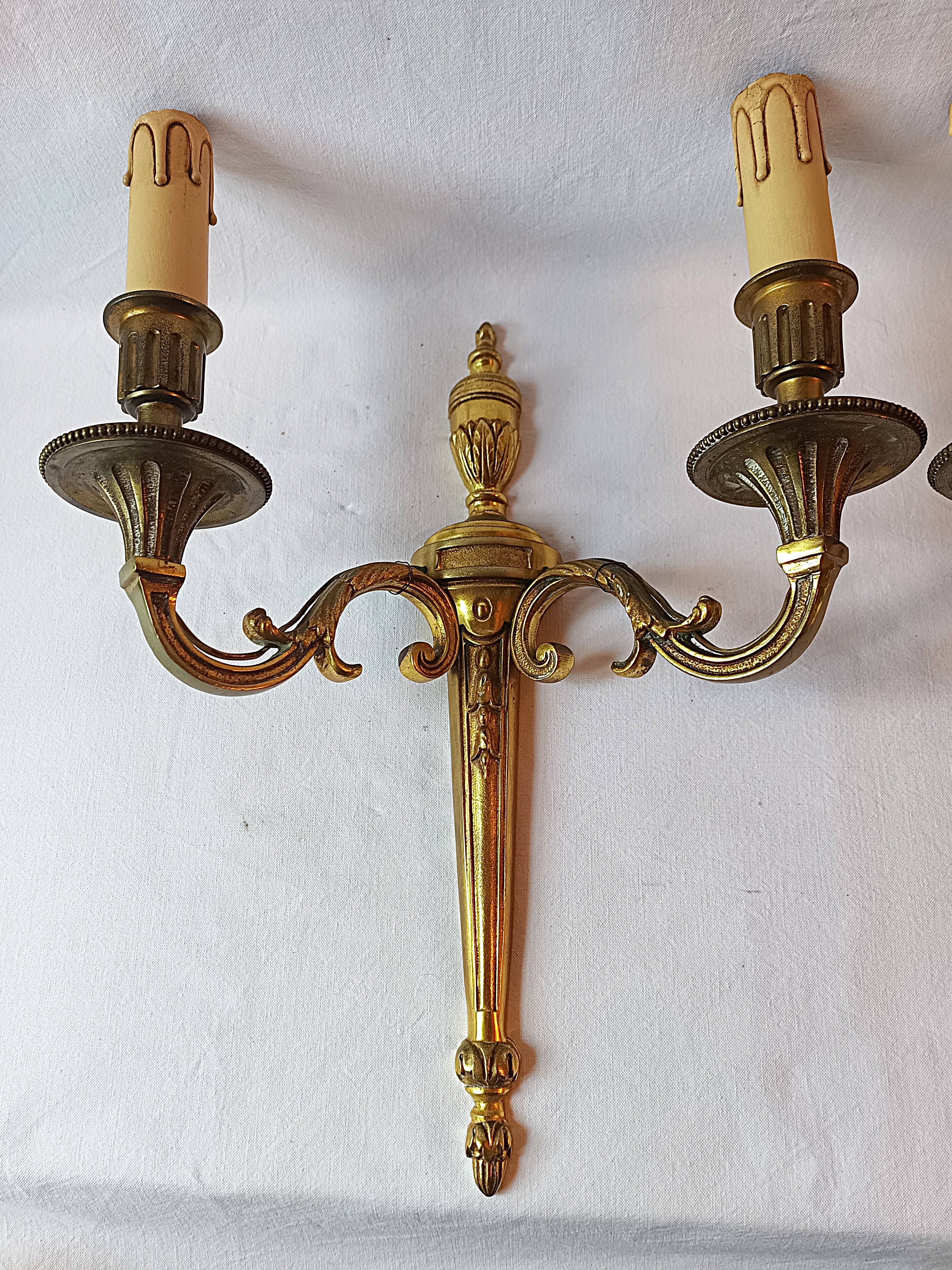 Pair of bronze wall sconces in Louis XVI style