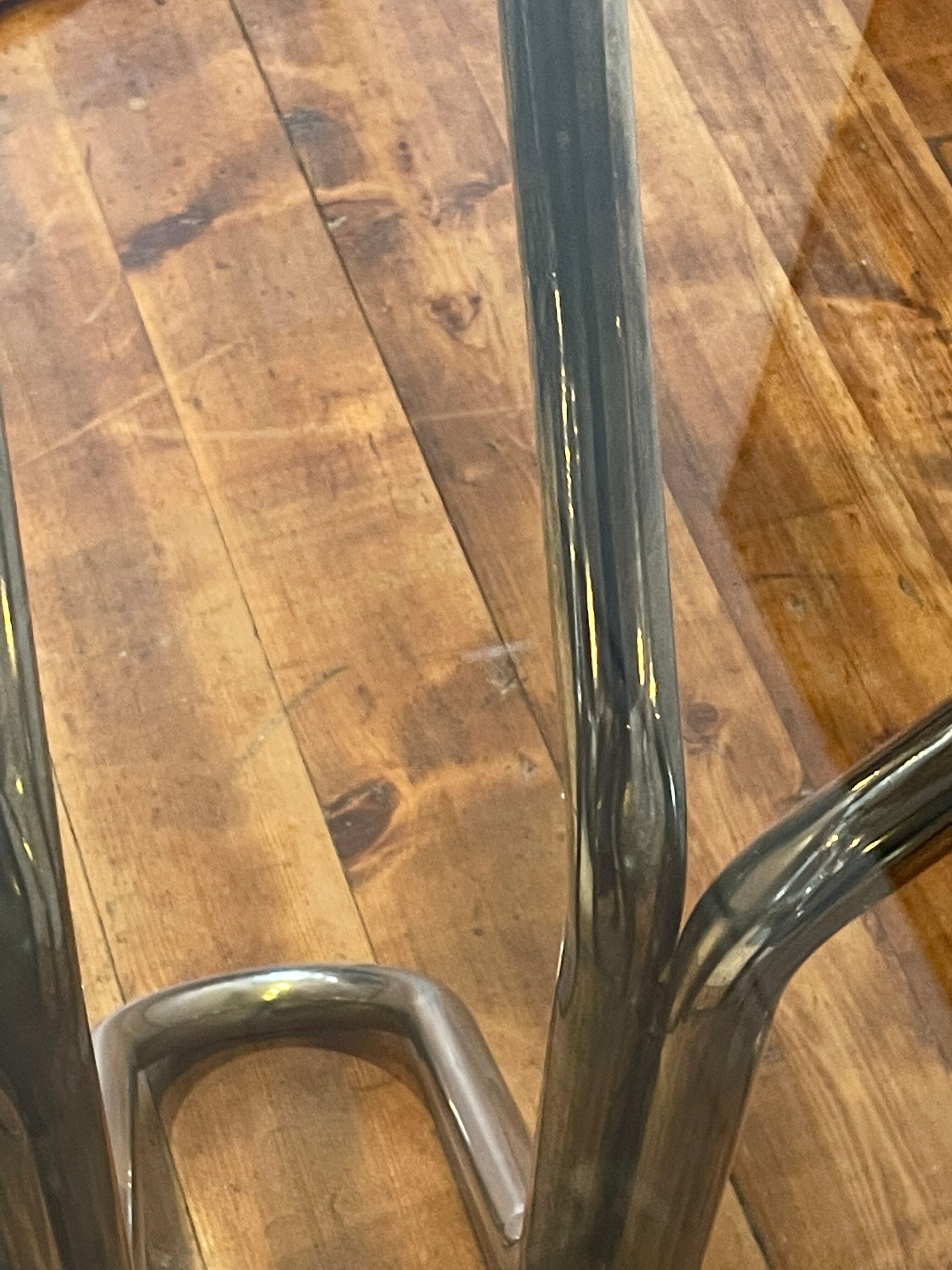 Round table in chrome and smoked glass