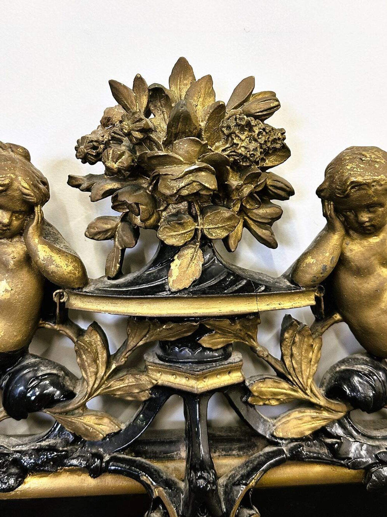 Antique 1800s black and gold mirror with cupid, France 1800s.