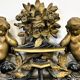 Antique 1800s black and gold mirror with cupid, France 1800s.