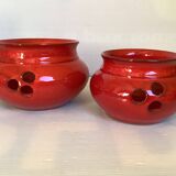 Pair of red Scandinavian candle holders.
