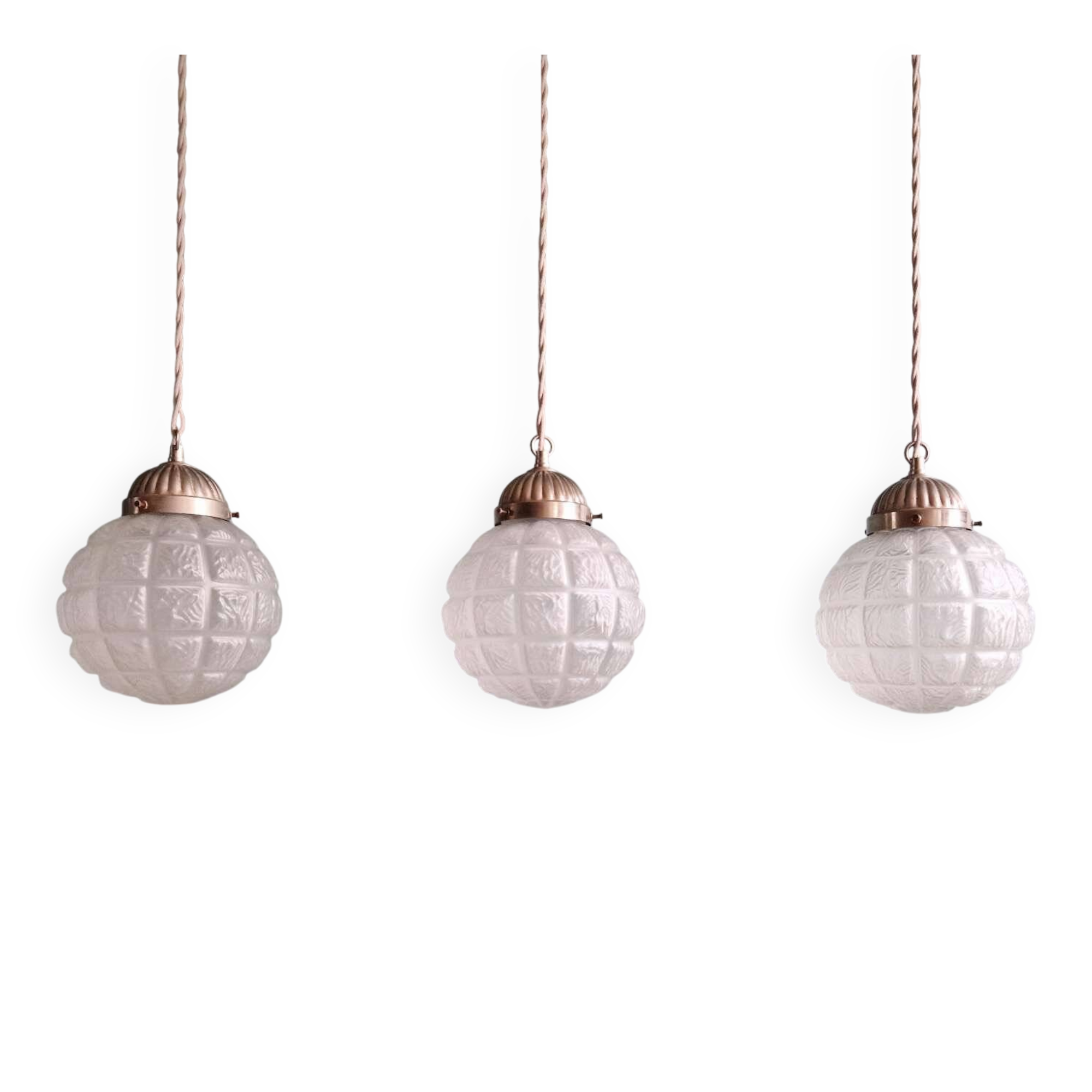 Art Deco trio of frosted glass pendants, 1920s-30s.
