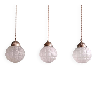 Art Deco trio of frosted glass pendants, 1920s-30s.