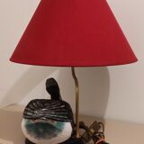 Decorative table lamp with a sculpted duck-shaped base and painted finish.