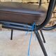 Brown faux leather armchairs