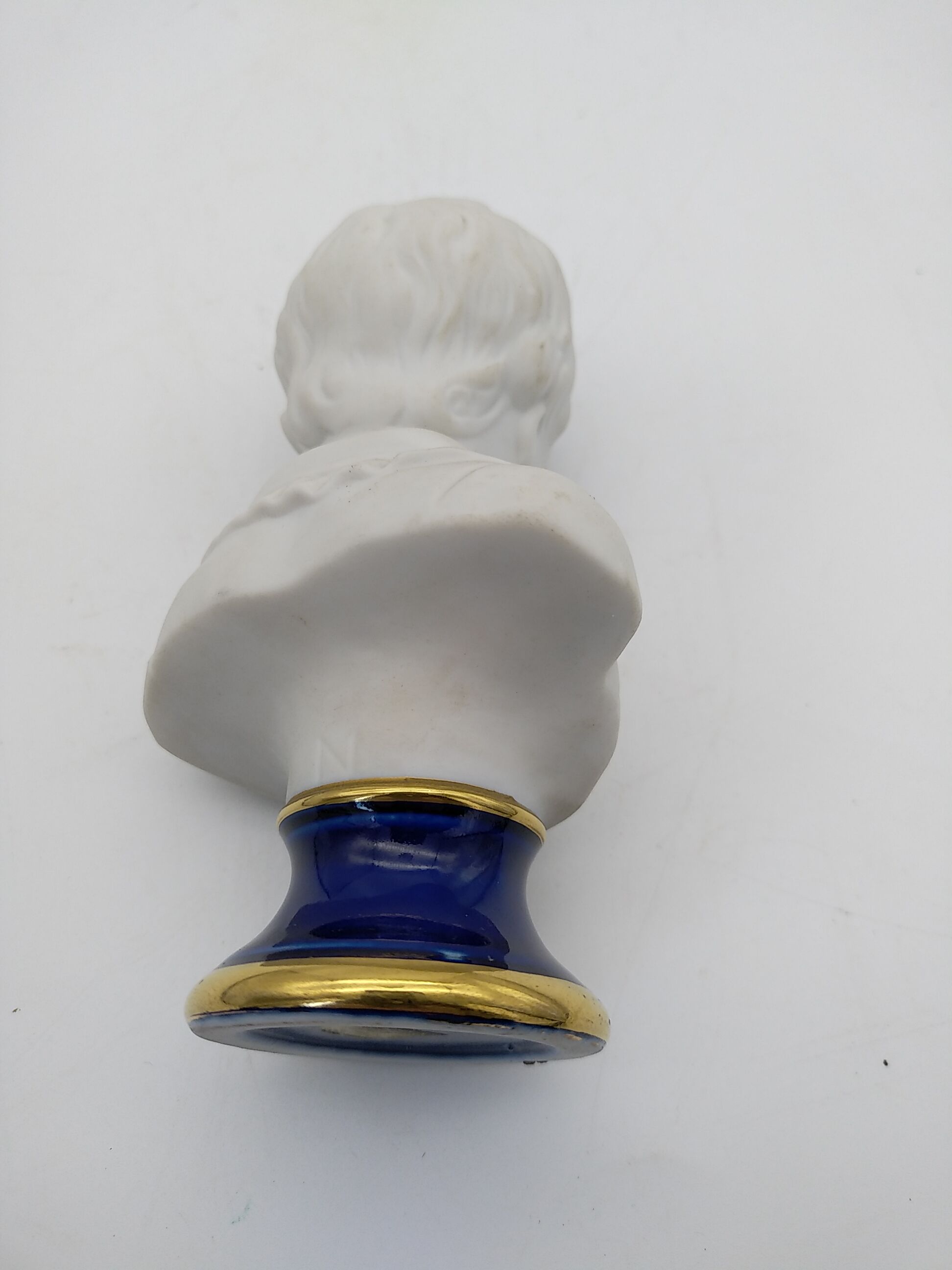 Child bust in biscuit. Capodimonte .