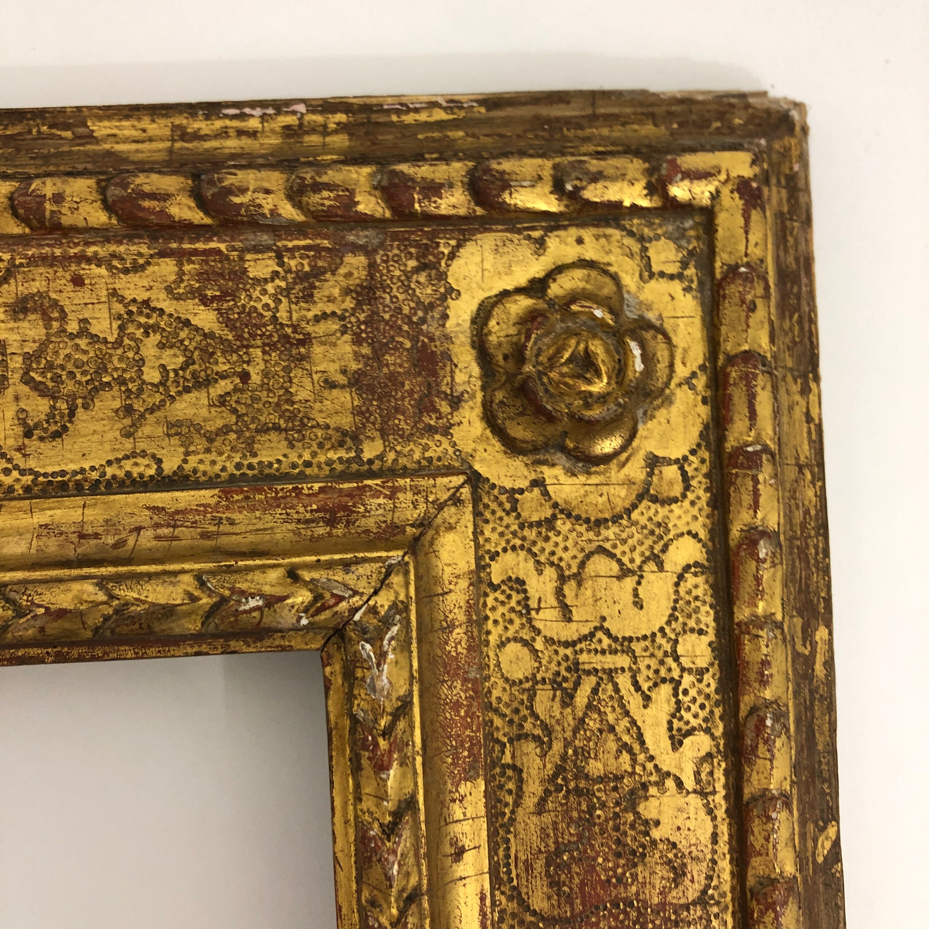 Vintage gilded frame decorated with stylized flowers