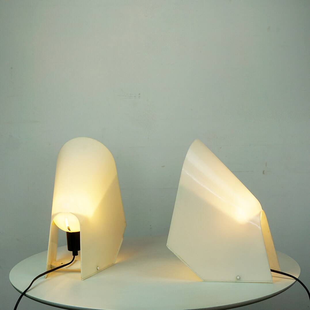 A pair of white plastic table lamps by Cini Boeri for Stilnovo, Italy.