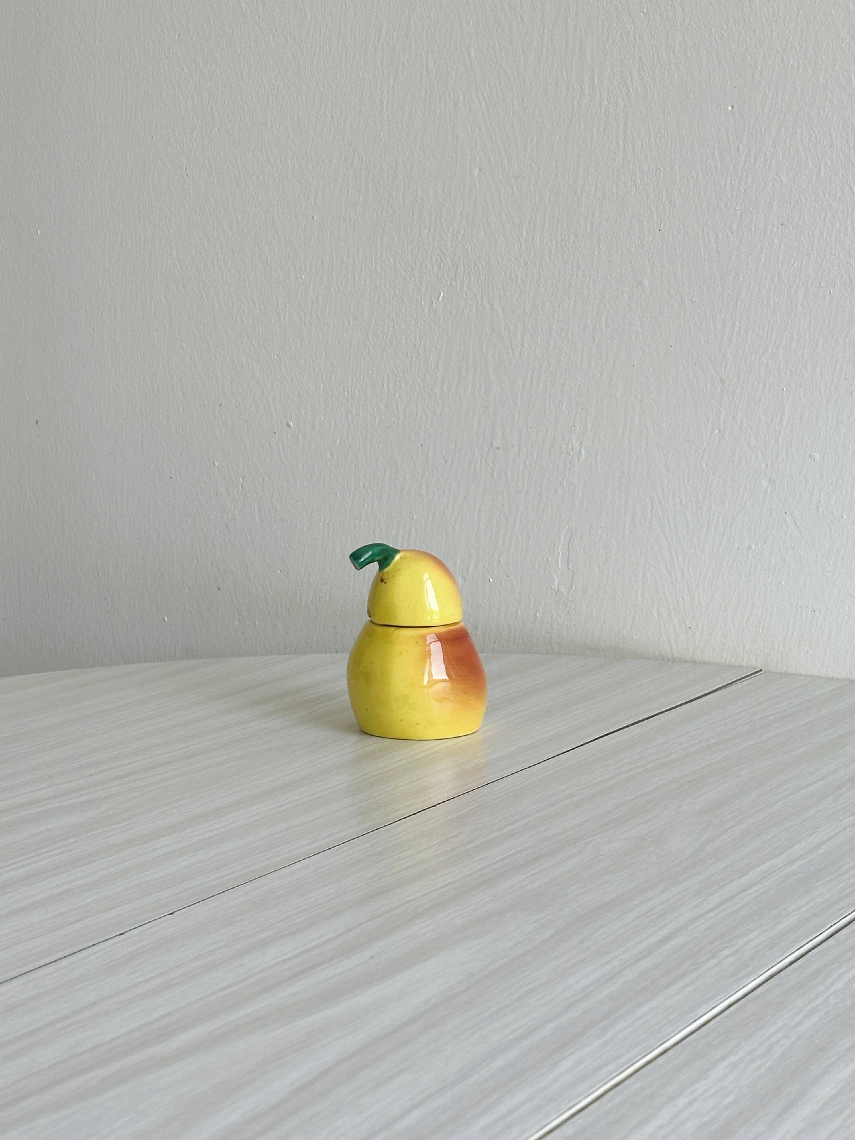 Yellow ceramic pear-shaped salt shaker