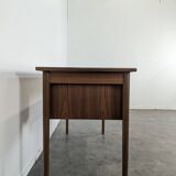 Scandinavian teak desk with a suspended drawer unit.