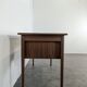Scandinavian teak desk with a suspended drawer unit.