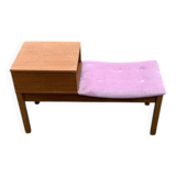 Mid-Century telephone bench in teak with bright pink fabric seat and wooden top.