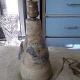 Sandstone lamp base with fleur-de-lis coat of arms