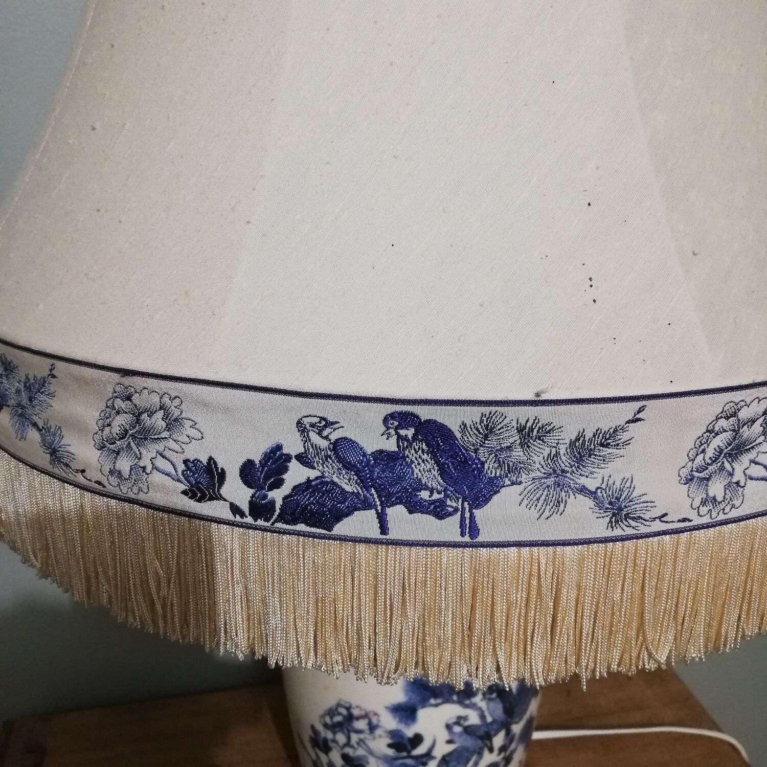 Ceramic lamp with Asian decoration with matching lampshade.