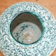 Green vase decorated with white enamels Cérart Monaco