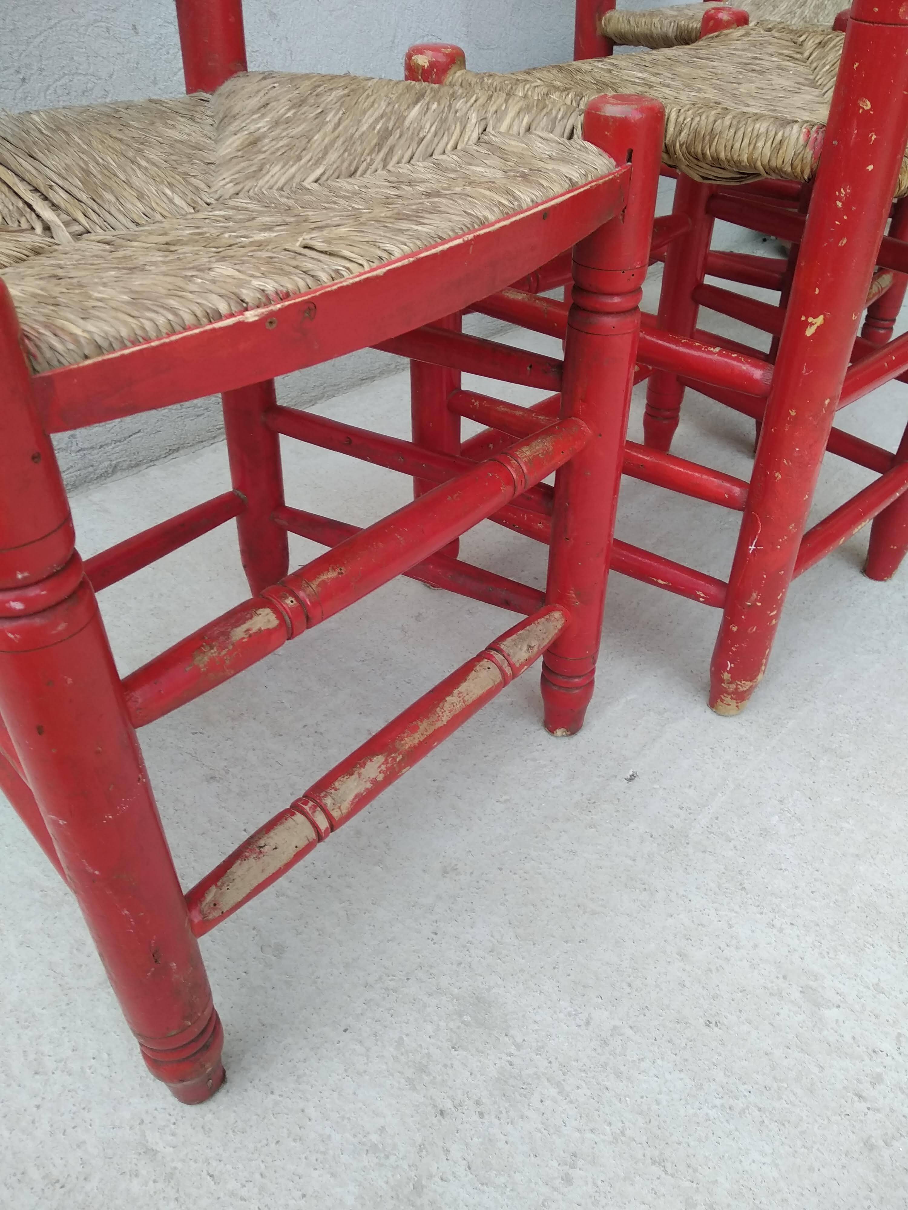 2 vintage red straw chairs