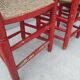 2 vintage red straw chairs
