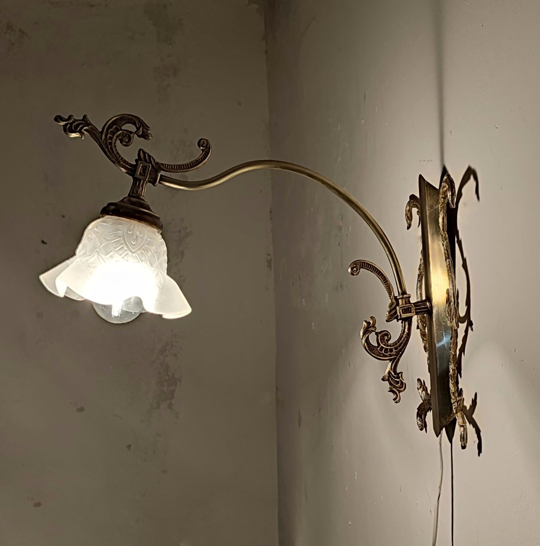 Bronze Modernist wall lamp. Spain, 1930s.