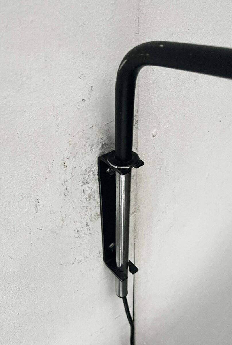 Mid-century modern Danish extendable cantilever wall lamp with a rattan shade, 1960s.