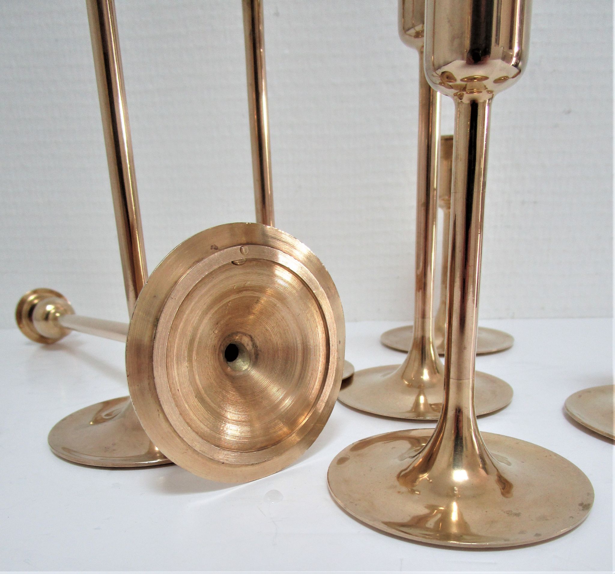Series of seven candle holders solid brass