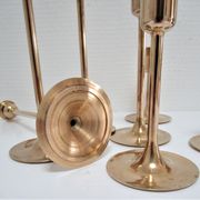 Series of seven candle holders solid brass