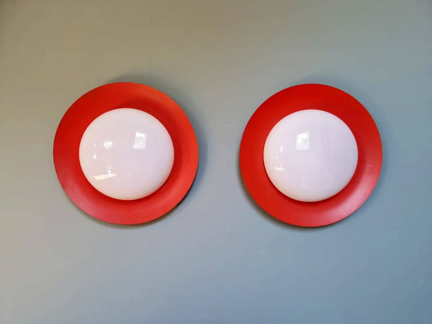 Pair of XXL Space Age wall sconces, orange lacquered metal and opaline, 1960.