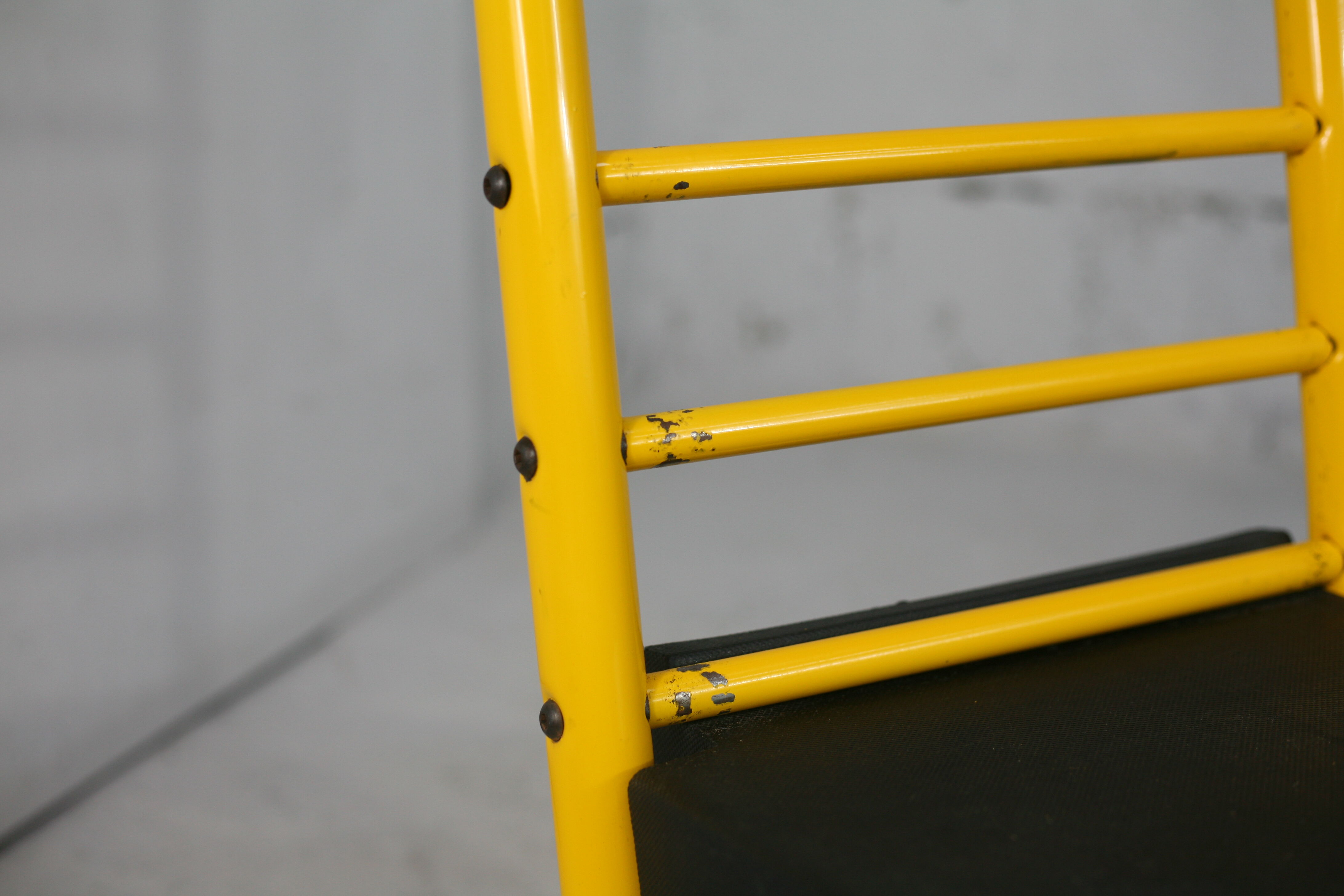 Adjustable seat chair. Circa 1980. Italy. Yellow lacquered steel.