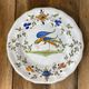 Set of 6 earthenware plates from Moustiers, featuring birds and flowers.