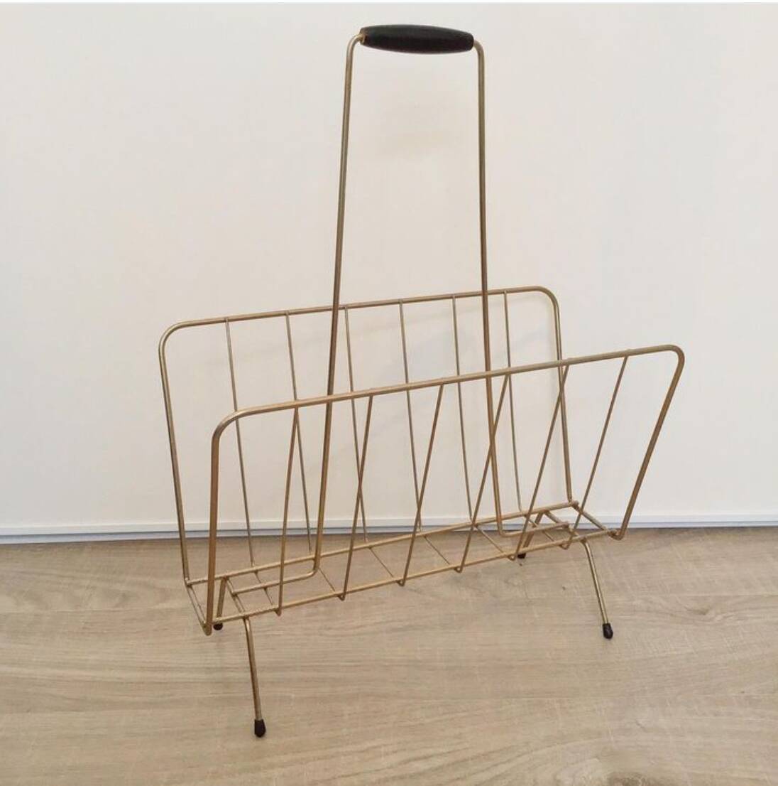 Vintage magazine rack in gold metal