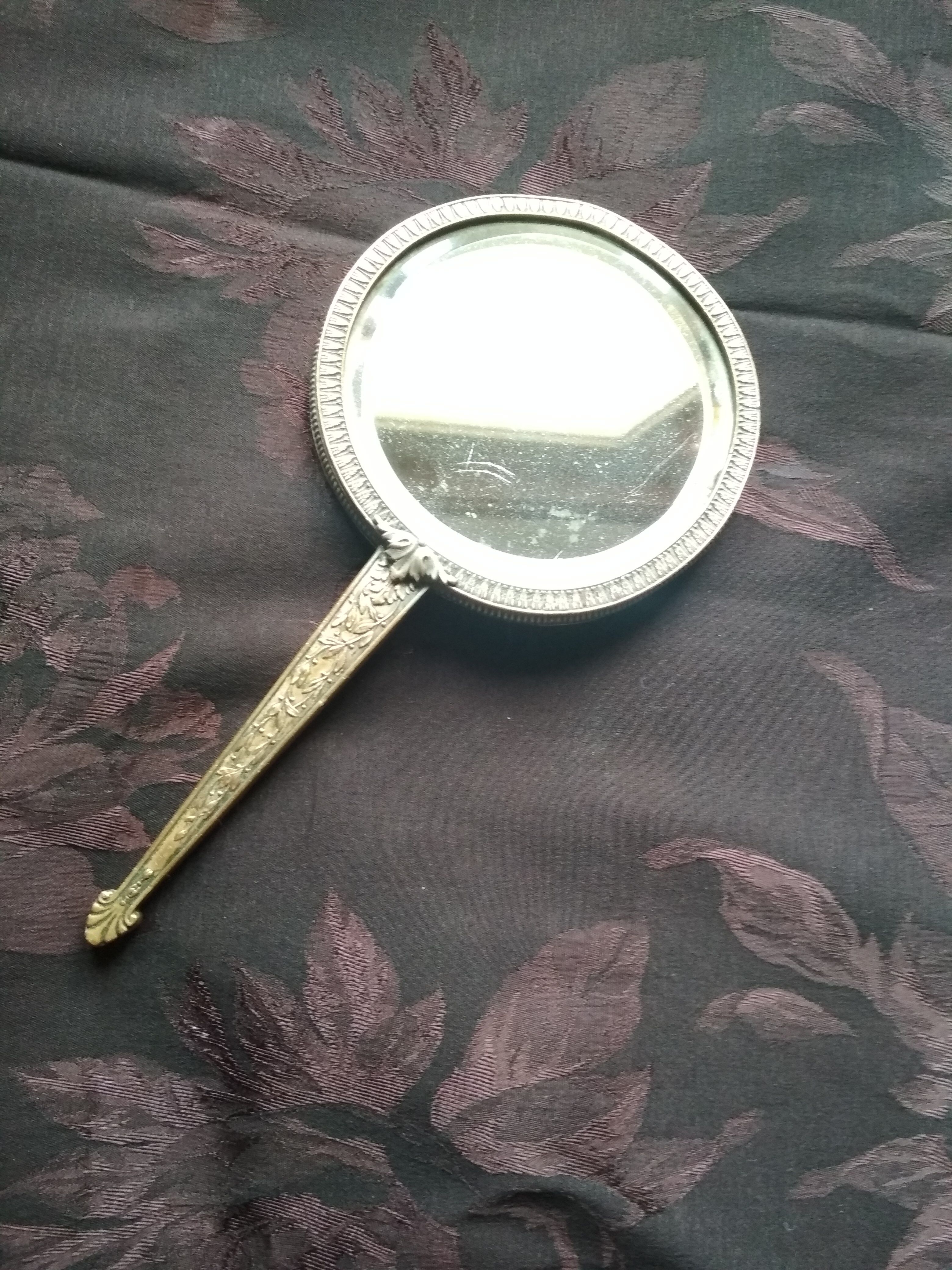 Old hand mirror beveled glass