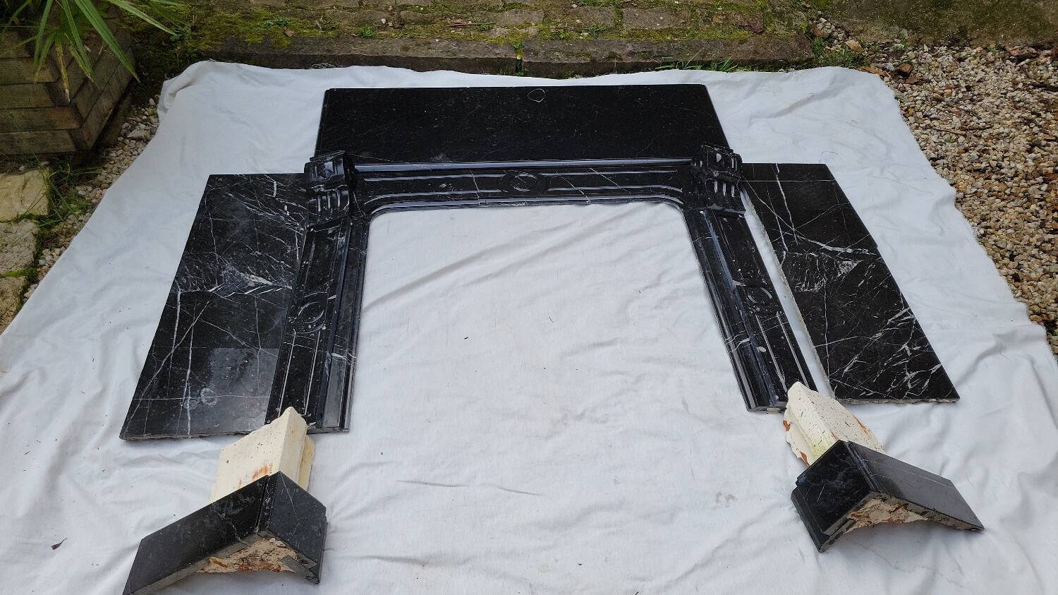 Pompadour fireplace with black marble modillions