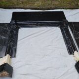 Pompadour fireplace with black marble modillions