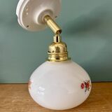 Vintage globe wall sconce in white opaline glass with floral decorations