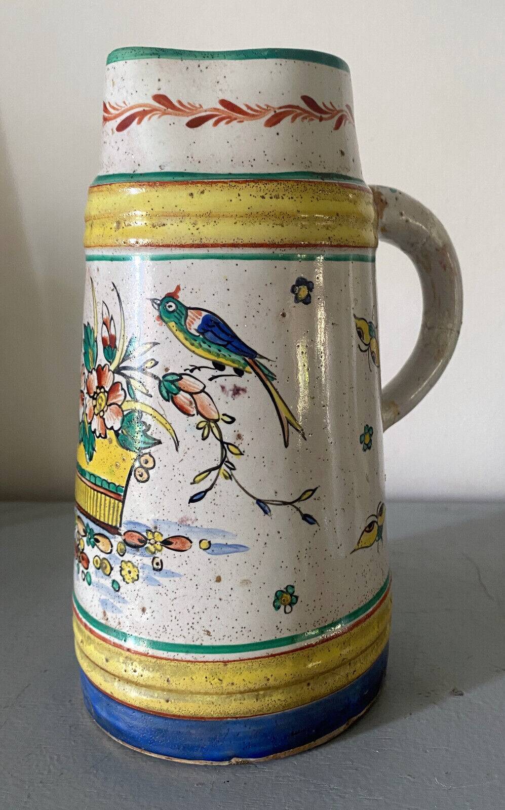 Old ceramic pitcher (18th century?) decorated with polychrome exotic birds