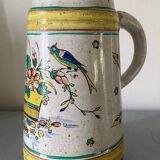 Old ceramic pitcher (18th century?) decorated with polychrome exotic birds