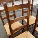 4 solid wood chairs with straw seats and high backs, 108cm.