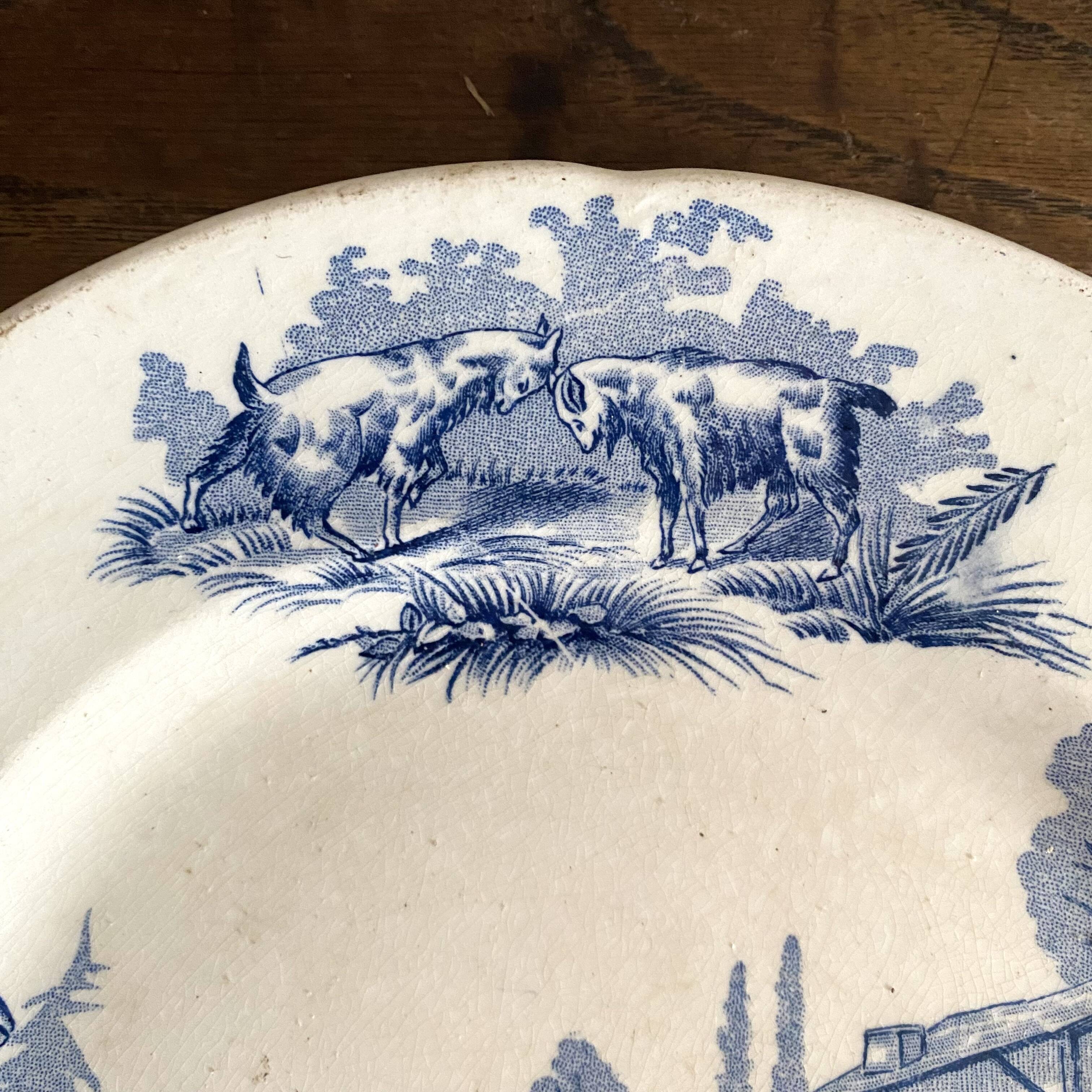 "Rustic" iron earth plate with goats