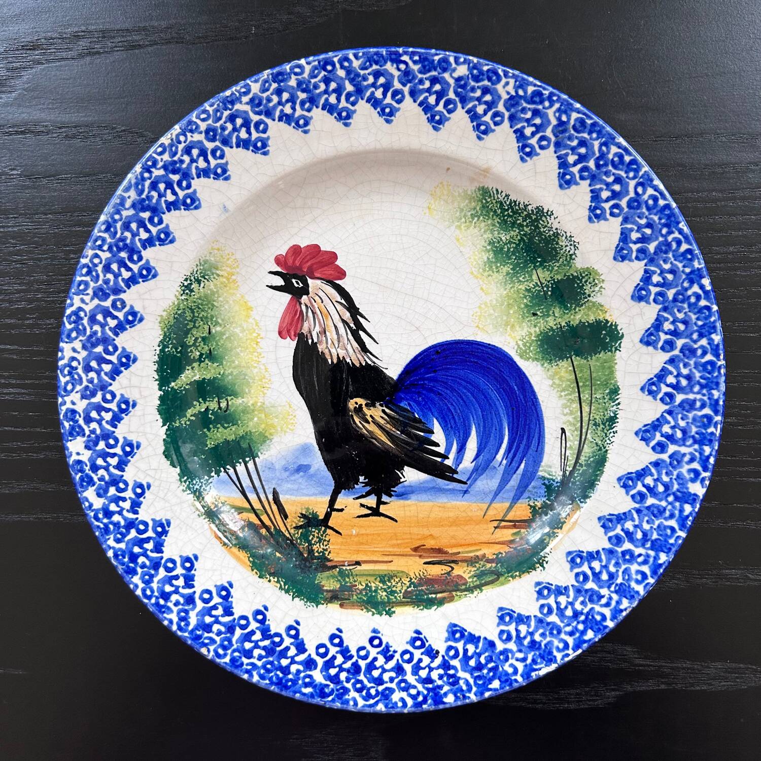 Old plate with rooster decoration