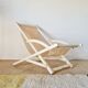 Old white wood deck chair Triconfort