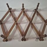 vintage wooden coat rack folds out like an accordion