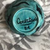 Pretty blue enamel bowl, signed "Courtade 81"