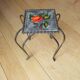 wrought iron and earthenware tile side table
