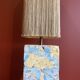 Base stuck blue beige marble-plaster, fringed lampshade Houles, 21st century.