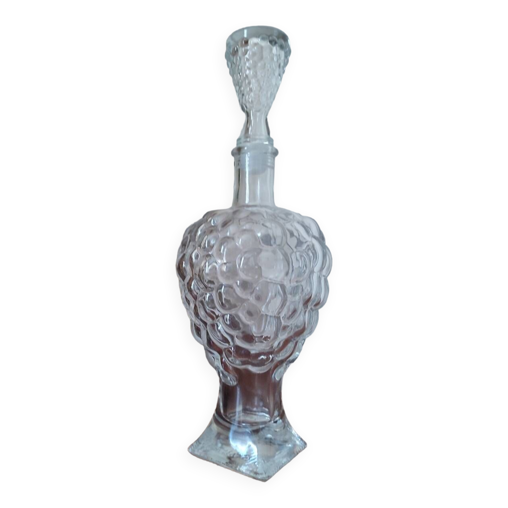 Pressed glass carafe in the shape of a bunch of grapes.