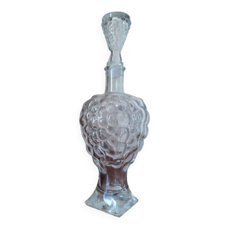 Old carafe in pressed glass grape cluster style