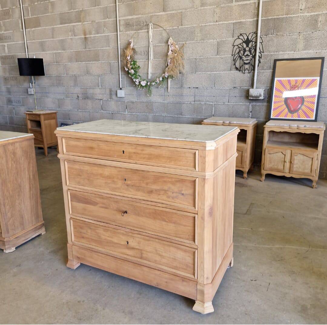 Walnut chest of drawers with white marble.