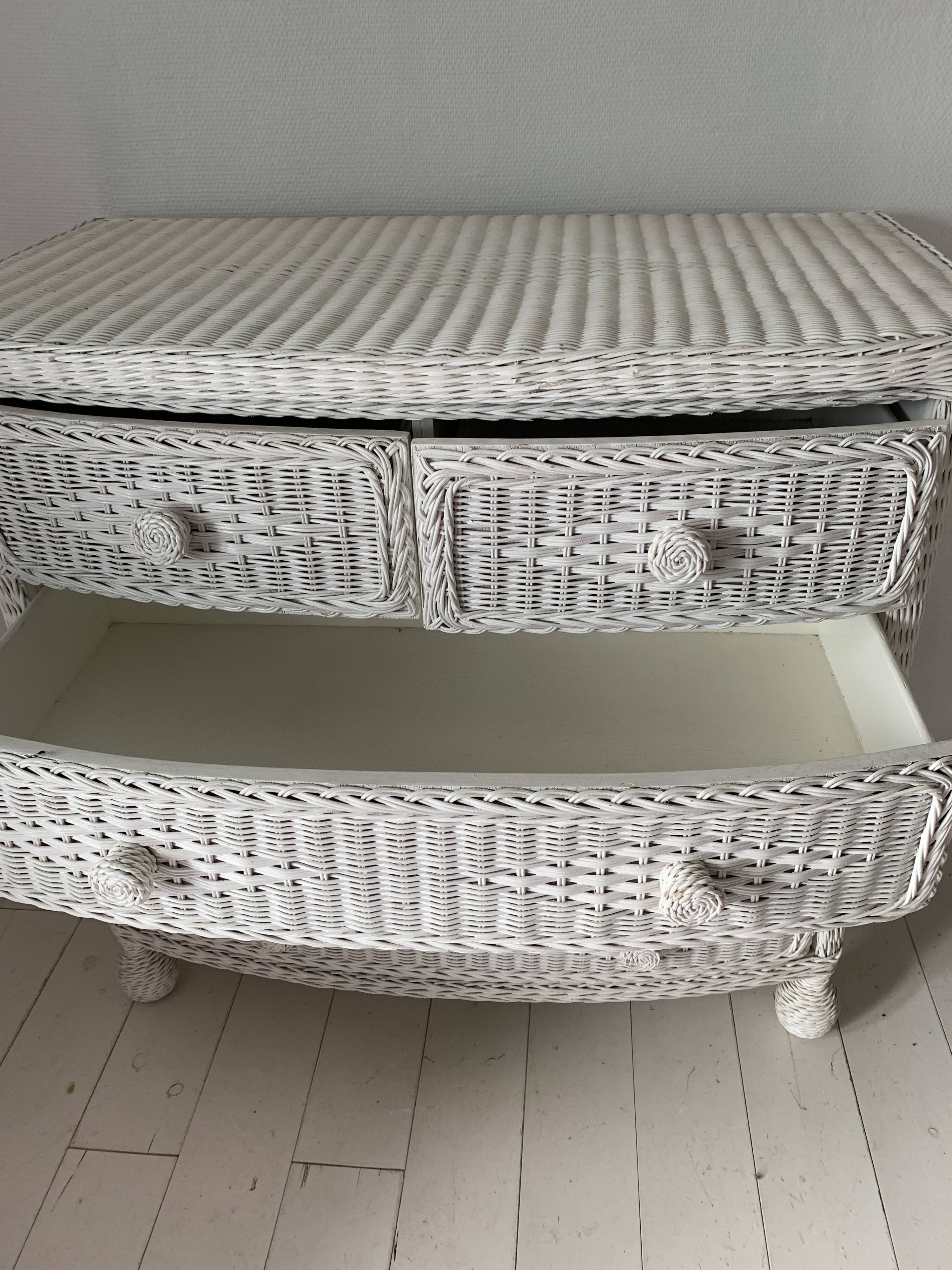 White dresser in vintage rattan