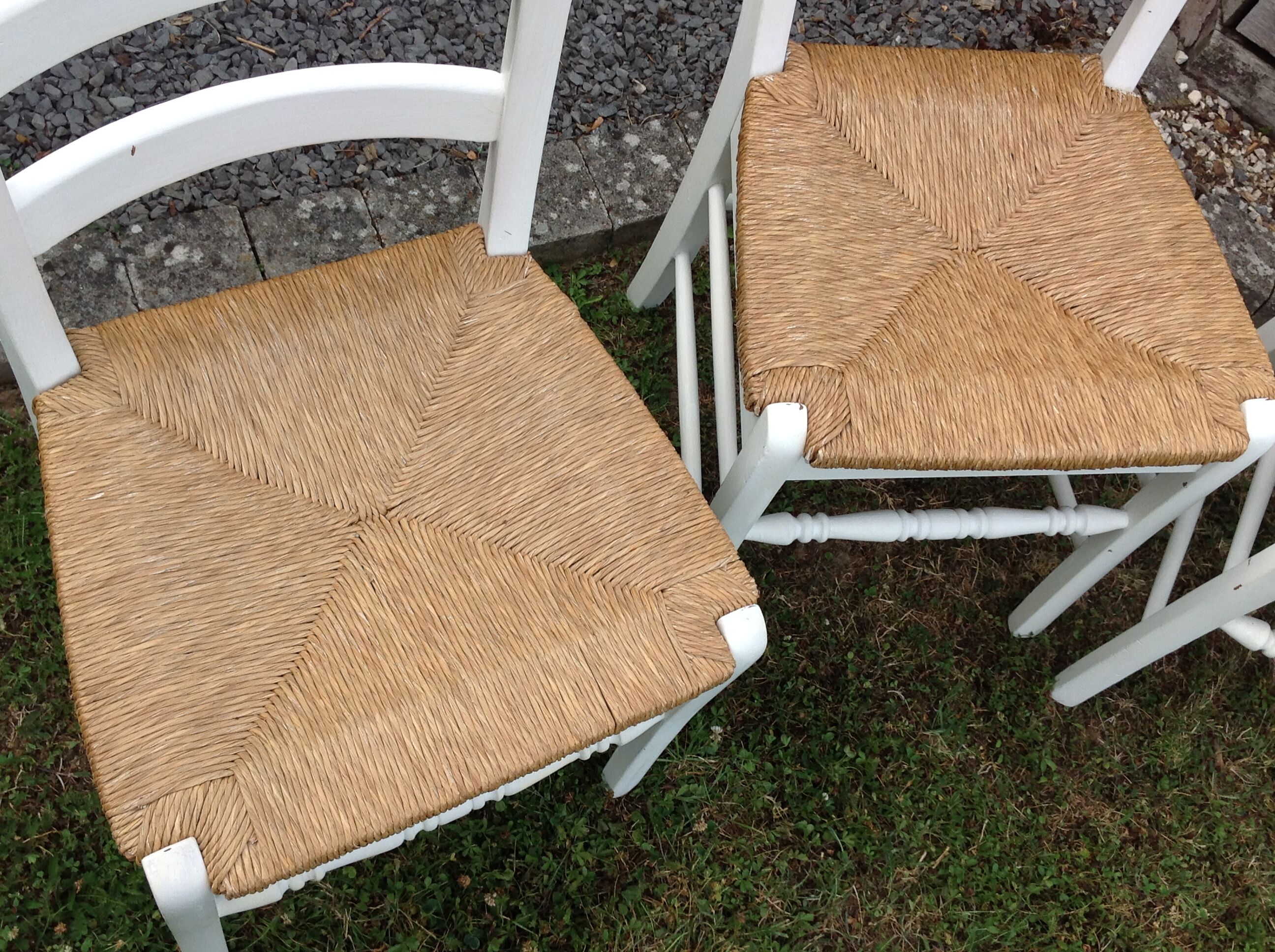 White farmhouse table set and four chairs