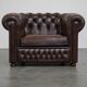 Beautiful and spacious dark brown mottled English cow leather Chesterfield armchair