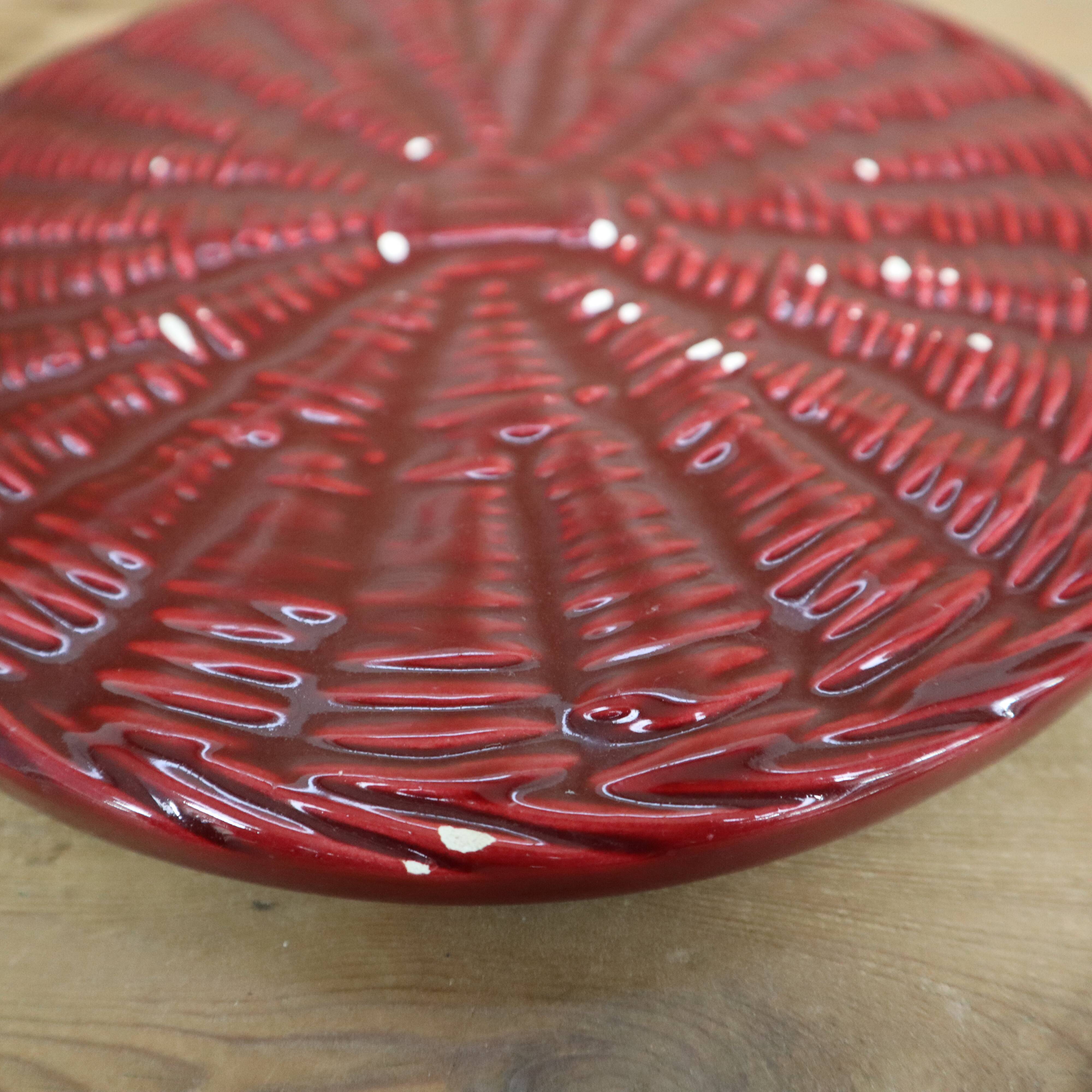 Burgundy slip tray and its small vintage knife from the 50s